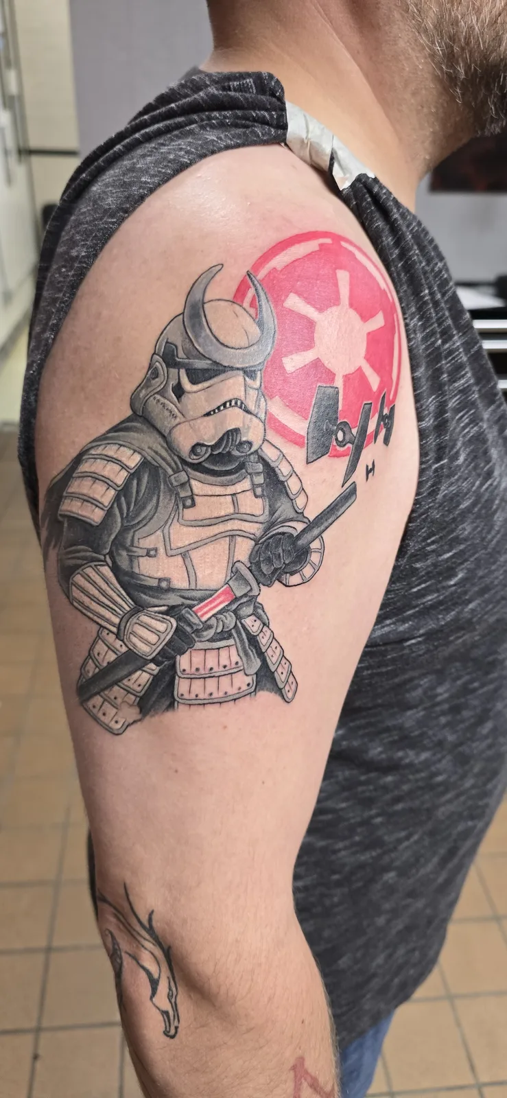Black and gray character shoulder tattoo by Joshua Key