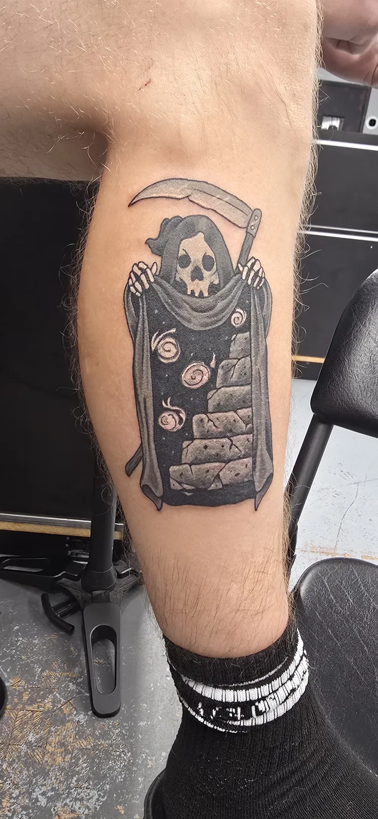 Reaper and tombstone leg tattoo by Joshua Key
