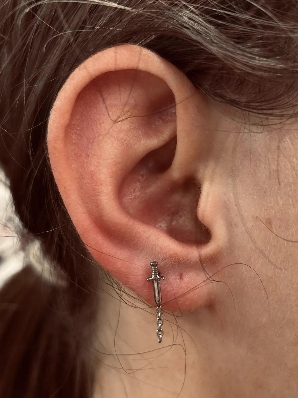 Lobe piercing with dangle chain jewelry by Sydney