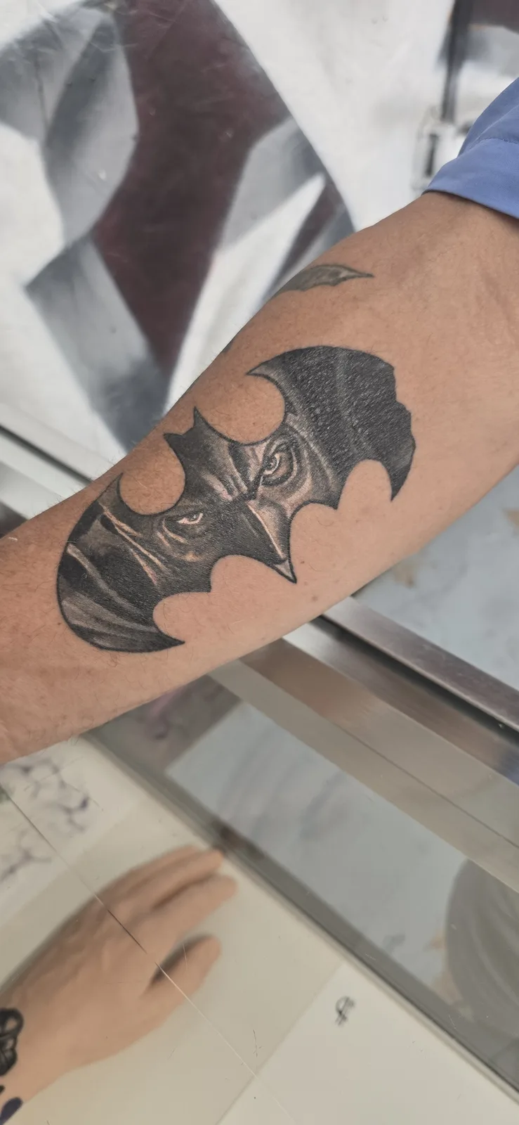 Black bat tattoo on the hand by Joshua Key