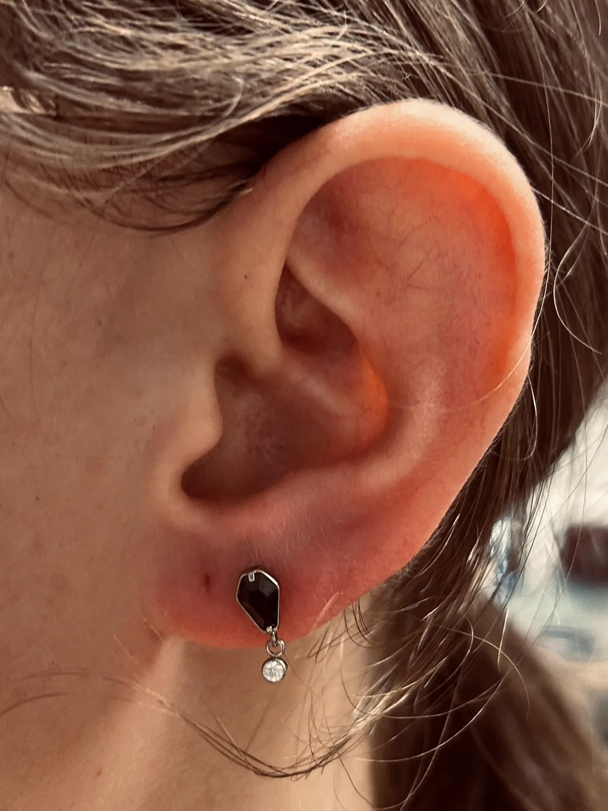 Lobe stack with hoops and black jewelry by Sydney