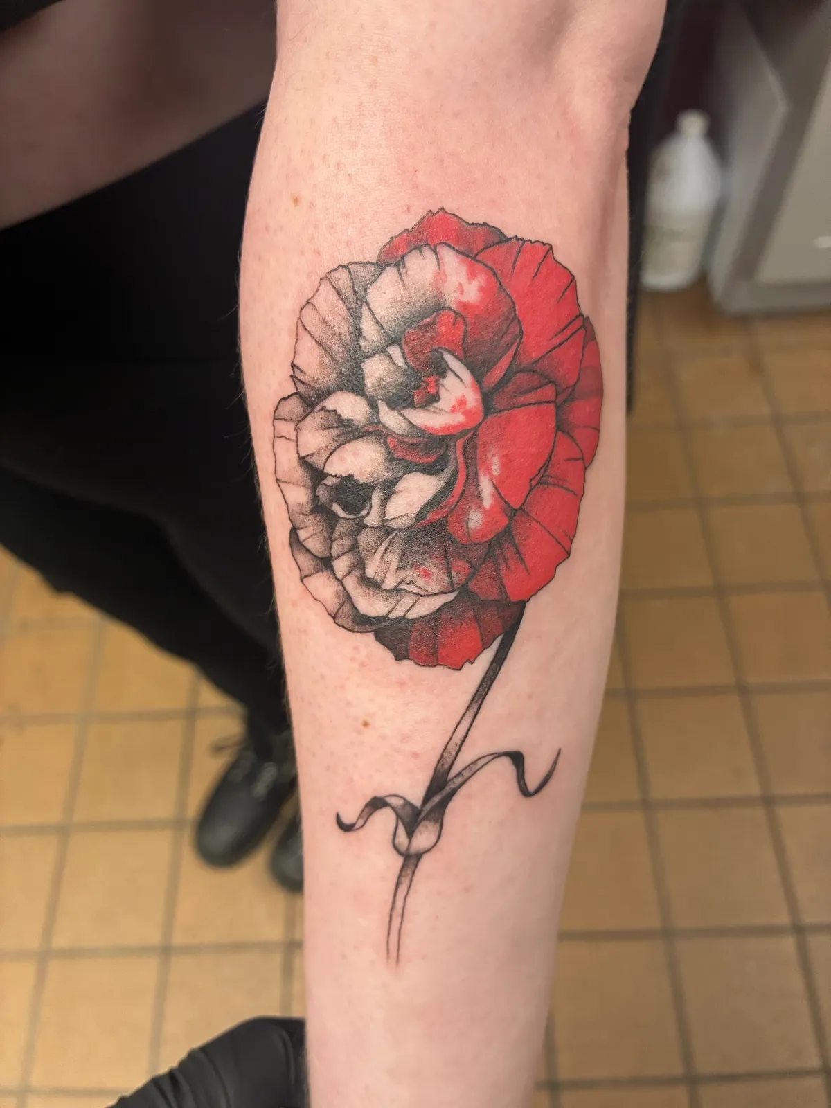 Black and gray rose forearm tattoo by Sav