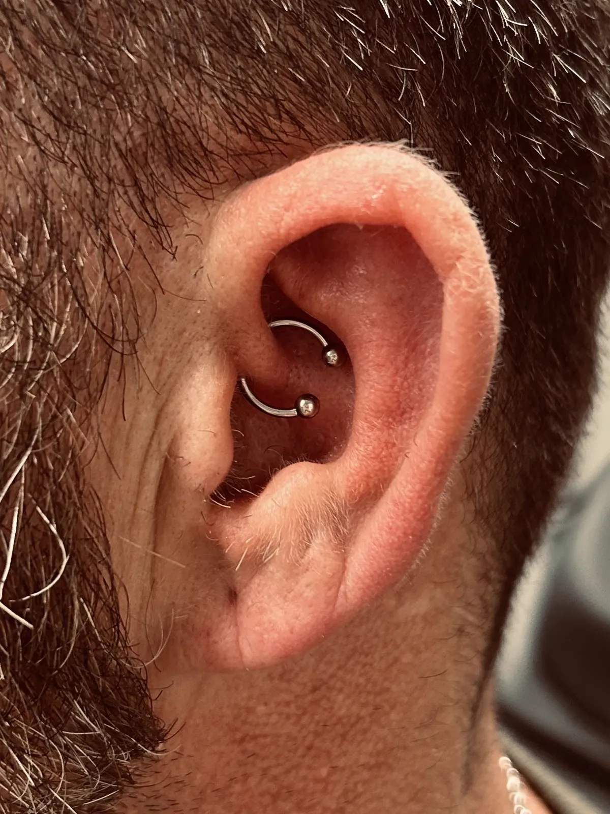 Daith hoop piercing by Sydney