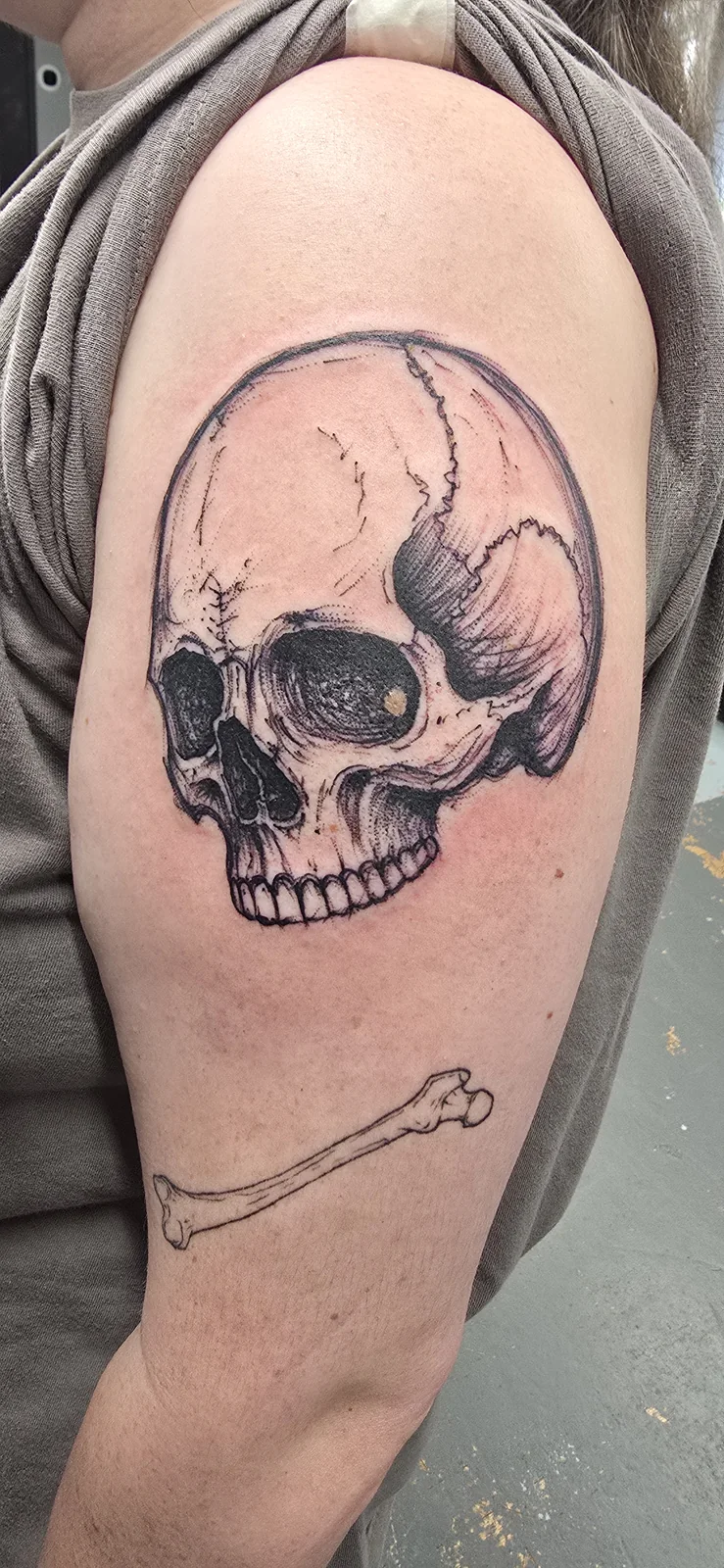 Black and gray skull tattoo by Branded Key Tattoo