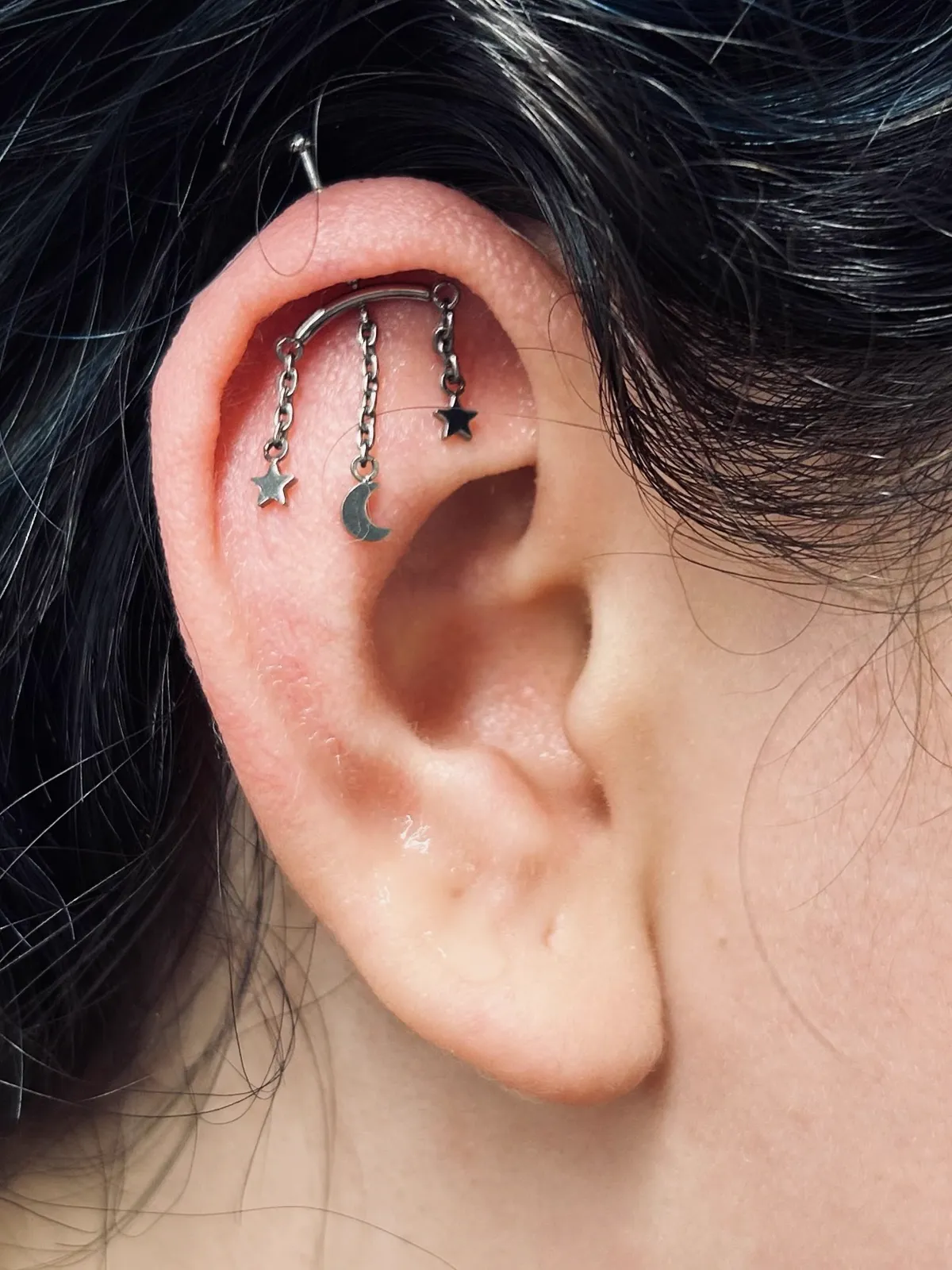 Helix chain jewelry along the ear by Sydney