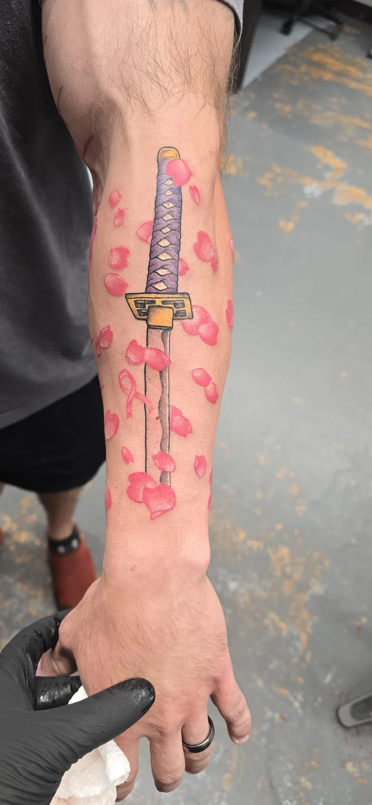 Katana and cherry blossom arm tattoo by Joshua Key