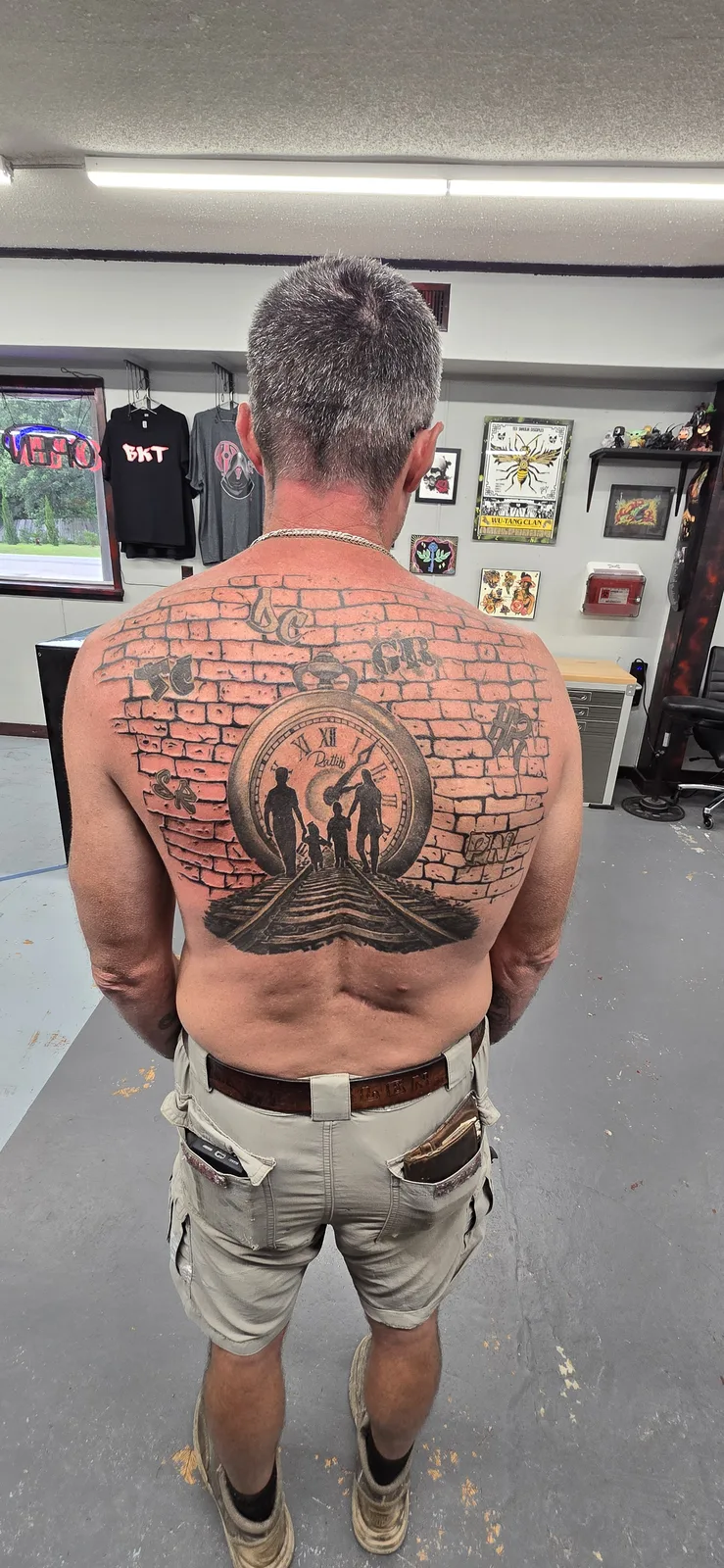 Large black and gray back piece tattoo by Joshua Key
