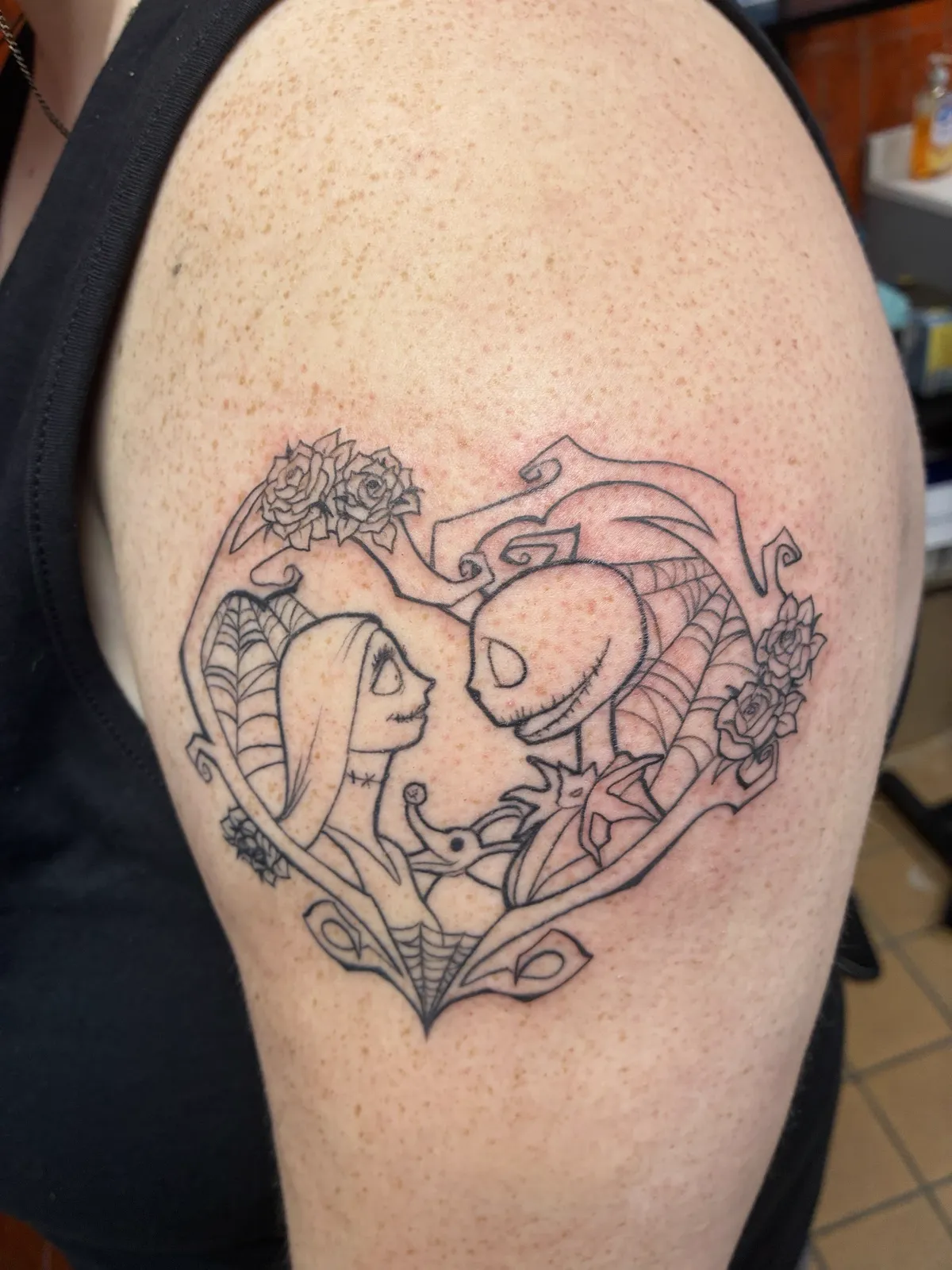 Fine line character heart shoulder tattoo by Sav