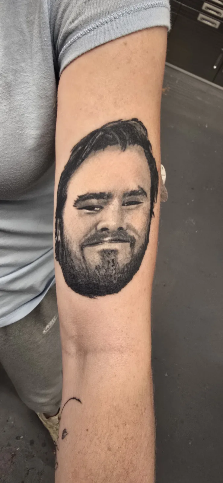 Realistic black and gray portrait tattoo by Joshua Key