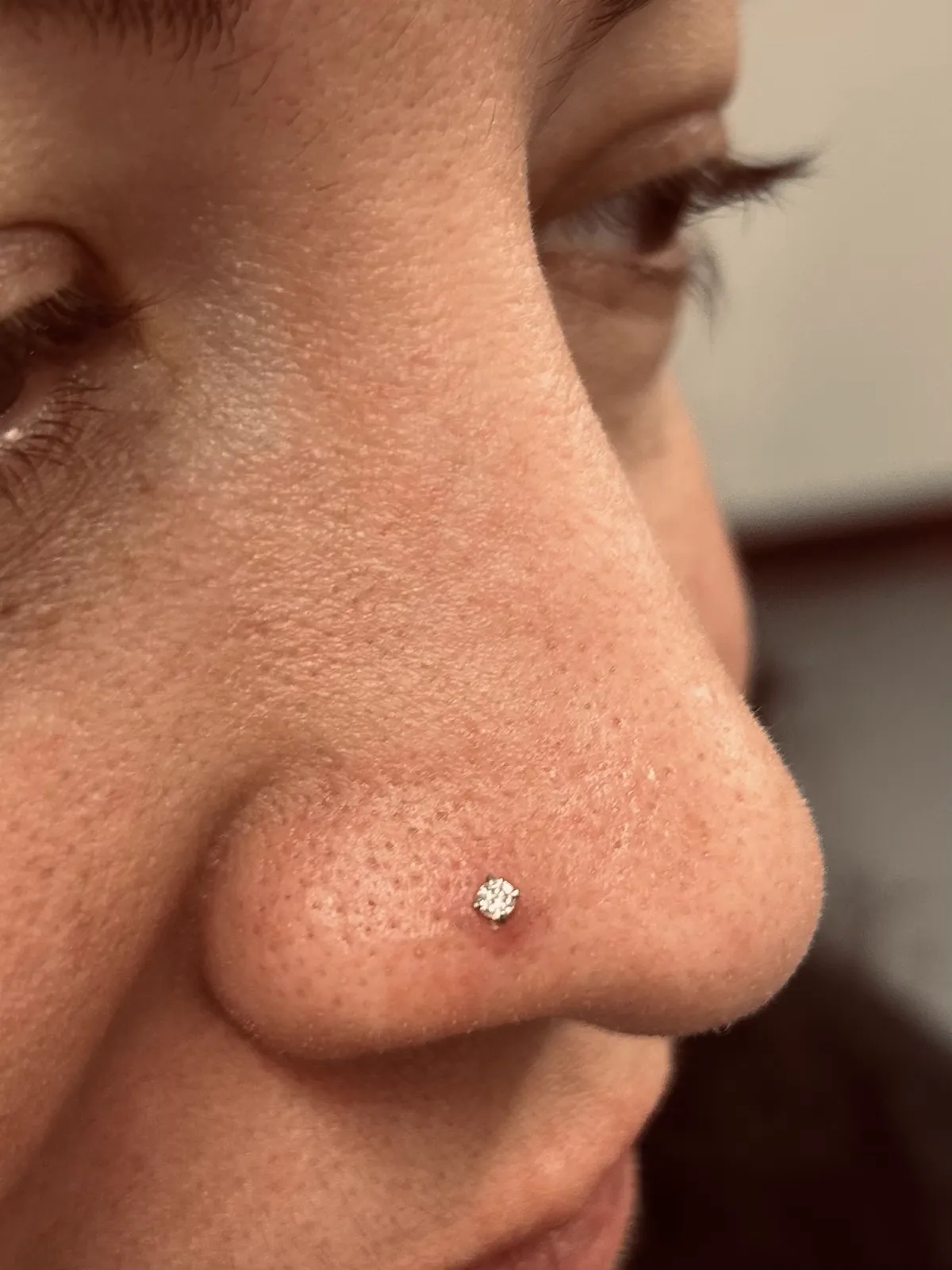 Nostril piercing with gem stud by Sydney